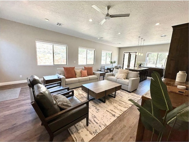 108 Trapper Cir Unit A, Springdale, UT 84767 - living room with wood finished floors, a textured ceiling, ceiling fan, recessed lighting, and baseboards