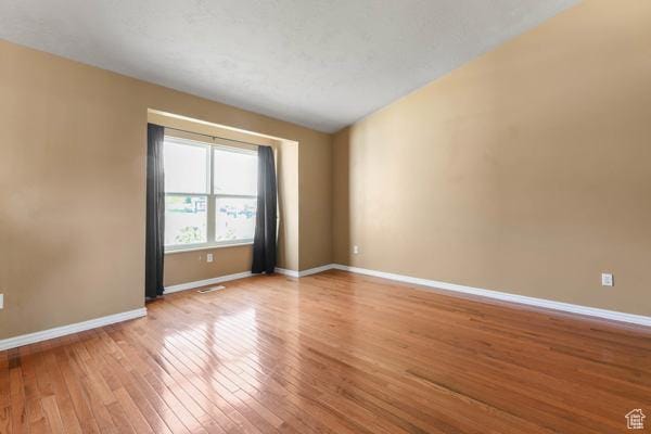 755 E 890 N, Tooele, UT 84074 - unfurnished room featuring wood-type flooring and baseboards
