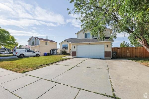755 E 890 N, Tooele, UT 84074 - traditional-style house featuring brick siding, driveway, and a garage