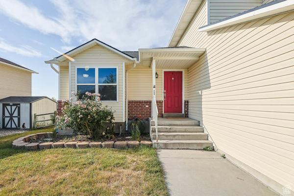 755 E 890 N, Tooele, UT 84074 - doorway to property with a lawn