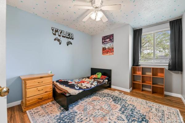 755 E 890 N, Tooele, UT 84074 - bedroom with baseboards, wood finished floors, and a ceiling fan
