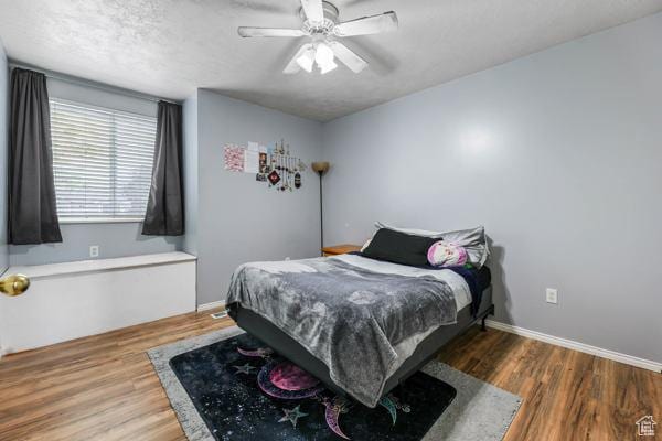 755 E 890 N, Tooele, UT 84074 - bedroom with wood finished floors, baseboards, and a ceiling fan
