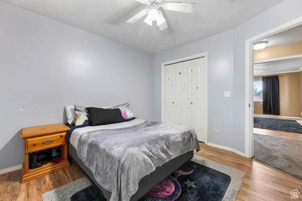 755 E 890 N, Tooele, UT 84074 - bedroom with baseboards, wood finished floors, a closet, and a ceiling fan