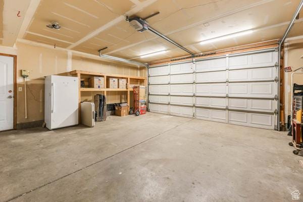 755 E 890 N, Tooele, UT 84074 - garage with freestanding refrigerator and a garage door opener