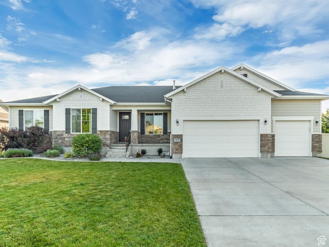 1373 S Thoroughbred Cir W, Kaysville, UT 84037 - view of front facade with a garage, stone siding, a front lawn, and driveway
