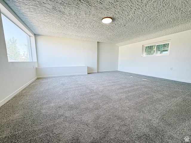 1797 N 5900 W, Warren, UT 84404 - empty room featuring a textured ceiling, carpet flooring, and baseboards