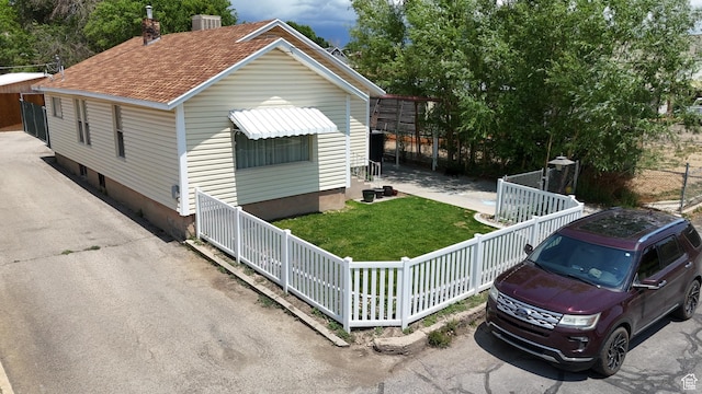 140 W 200 N, Price, UT 84501 - view of front of property featuring roof with shingles and a chimney
