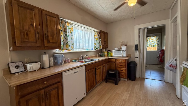 140 W 200 N, Price, UT 84501 - kitchen with white appliances, a sink, light wood-style flooring, light countertops, and ceiling fan