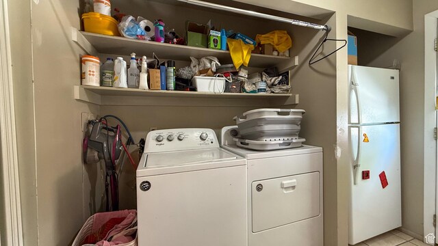 140 W 200 N, Price, UT 84501 - laundry area with washing machine and dryer and light tile patterned floors