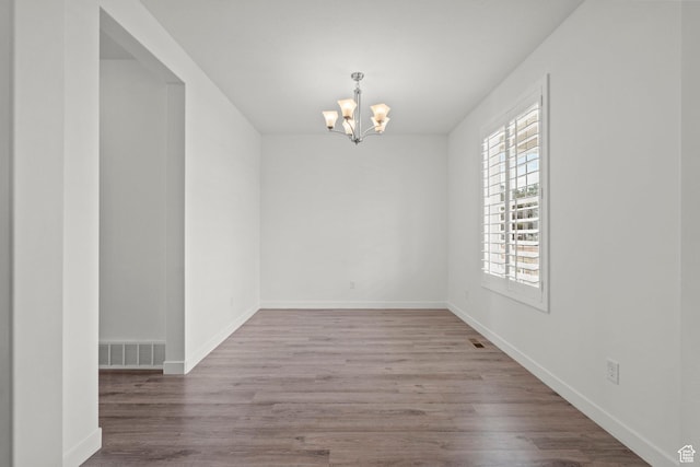 1314 W 1550 N, Lehi, UT 84043 - unfurnished room with a chandelier, wood finished floors, and baseboards
