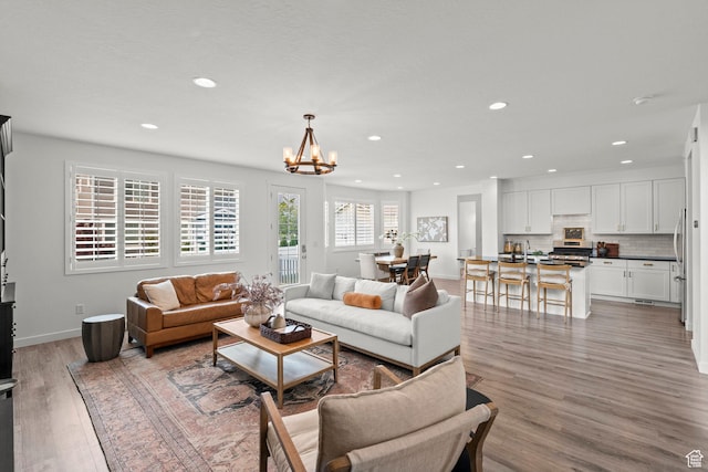 1314 W 1550 N, Lehi, UT 84043 - living area featuring recessed lighting, light wood-style flooring, a chandelier, and baseboards