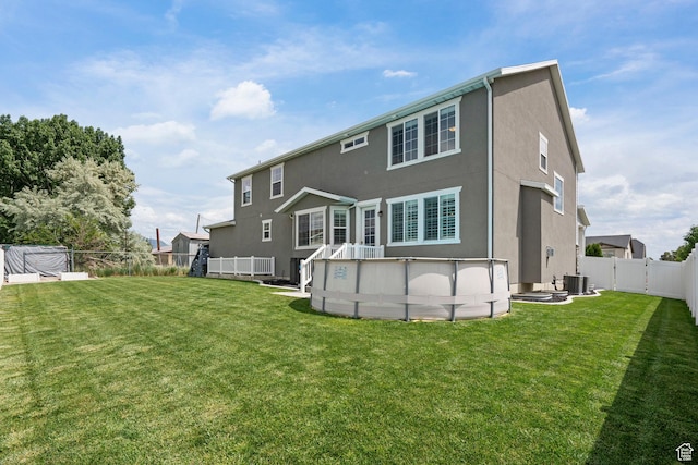 1314 W 1550 N, Lehi, UT 84043 - rear view of property with stucco siding, an outdoor pool, and central air condition unit