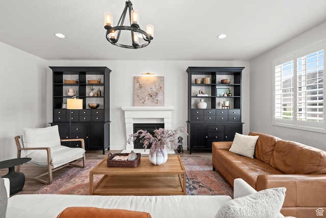 1314 W 1550 N, Lehi, UT 84043 - living area featuring a chandelier, a fireplace with raised hearth, wood finished floors, and recessed lighting