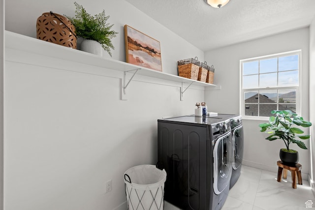 1314 W 1550 N, Lehi, UT 84043 - laundry area featuring washer and clothes dryer, light marble finish flooring, a textured ceiling, and baseboards