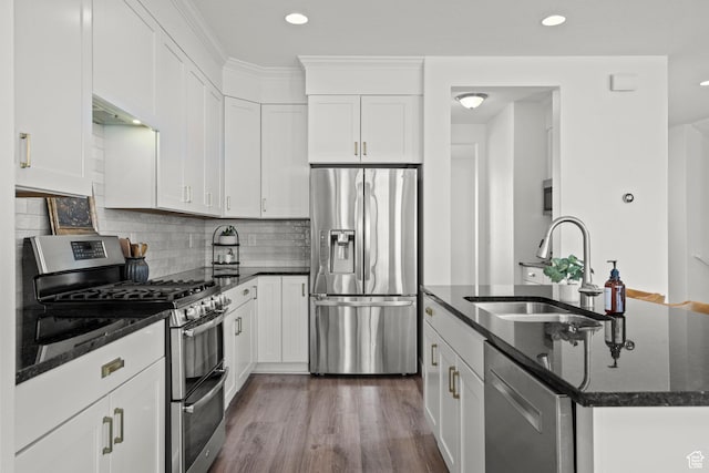 1314 W 1550 N, Lehi, UT 84043 - kitchen featuring appliances with stainless steel finishes, a sink, a center island with sink, dark stone countertops, and dark wood-style flooring