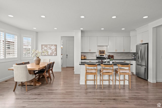 1314 W 1550 N, Lehi, UT 84043 - kitchen featuring stainless steel refrigerator with ice dispenser, dark countertops, recessed lighting, tasteful backsplash, and a sink