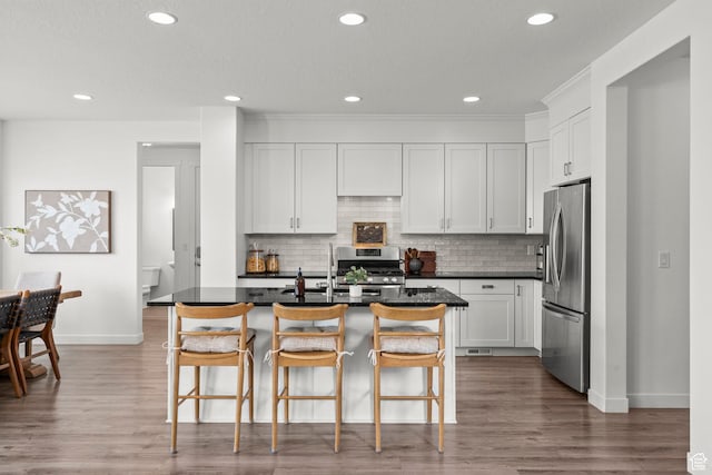 1314 W 1550 N, Lehi, UT 84043 - kitchen featuring stainless steel appliances, baseboards, dark countertops, decorative backsplash, and recessed lighting