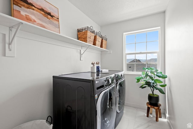 1314 W 1550 N, Lehi, UT 84043 - laundry room with washer and clothes dryer, baseboards, and a textured ceiling