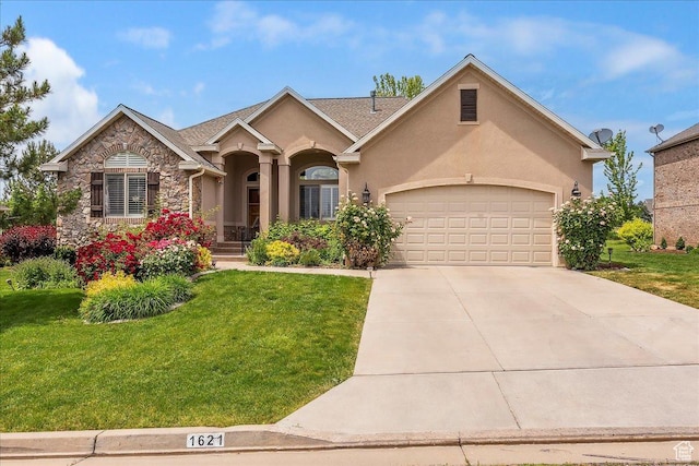 1621 E Poets N, Layton, UT 84040 - view of front of property with a front lawn, concrete driveway, a garage, stone siding, and stucco siding