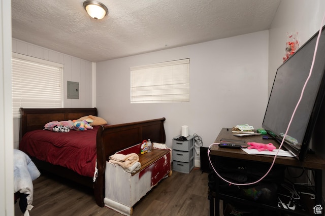 8750 W Helen Dr N, Magna, UT 84044 - bedroom featuring wood finished floors, a textured ceiling, and electric panel