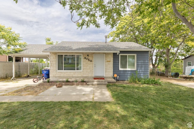 8750 W Helen Dr N, Magna, UT 84044 - view of front of house featuring a shingled roof, an attached carport, and stone siding
