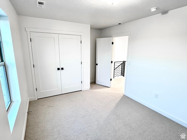 11208 S Easy Bee St Unit 268, South Jordan, UT 84009 - unfurnished bedroom with carpet flooring, baseboards, and a closet