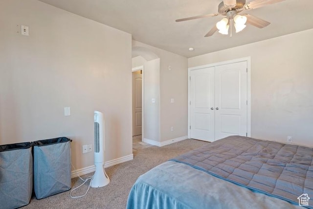 3972 S Lake Vista Dr, Saratoga Springs, UT 84045 - bedroom featuring carpet floors, arched walkways, a ceiling fan, a closet, and baseboards