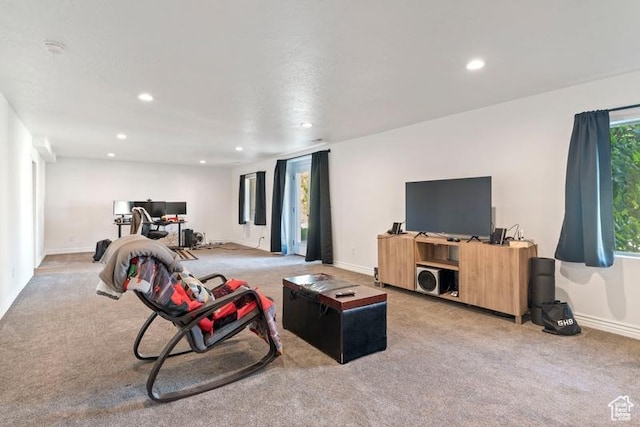 3972 S Lake Vista Dr, Saratoga Springs, UT 84045 - living area with carpet flooring, recessed lighting, baseboards, plenty of natural light, and a desk
