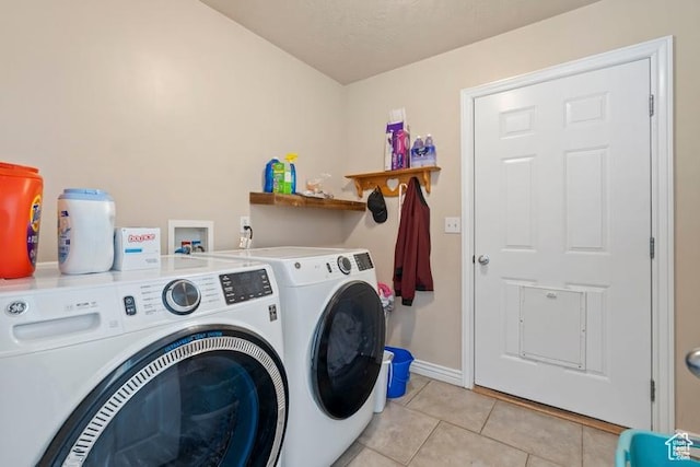 3972 S Lake Vista Dr, Saratoga Springs, UT 84045 - laundry room with washer and dryer, light tile patterned flooring, and baseboards