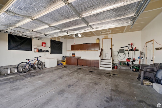 593 N 680 W, Tooele, UT 84074 - garage featuring a garage door opener