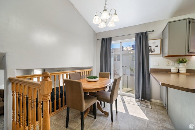 593 N 680 W, Tooele, UT 84074 - dining space with a chandelier, vaulted ceiling, and light tile patterned flooring