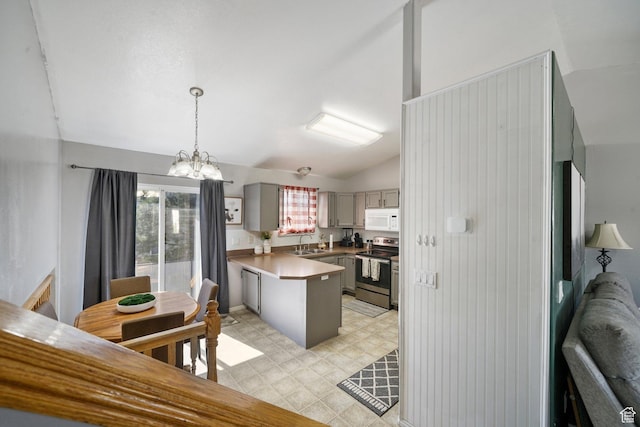 593 N 680 W, Tooele, UT 84074 - kitchen with stainless steel electric range, white microwave, a sink, a peninsula, and gray cabinetry