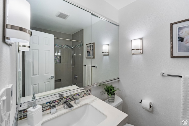42 Benchmark Vlg, Tooele, UT 84074 - full bathroom featuring backsplash, toilet, a shower, and vanity