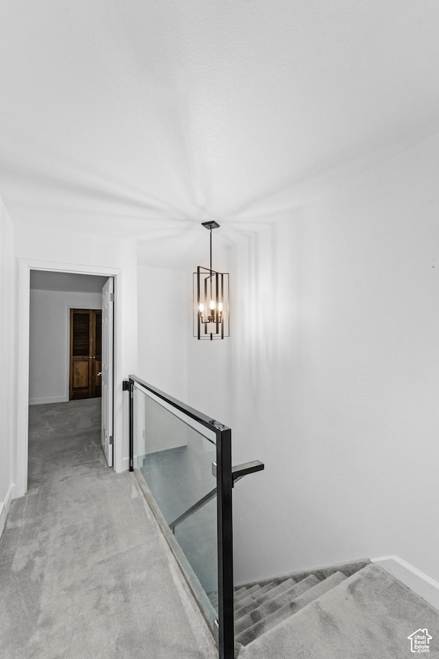 42 Benchmark Vlg, Tooele, UT 84074 - stairs with carpet, baseboards, and a chandelier
