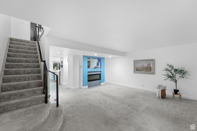 42 Benchmark Vlg, Tooele, UT 84074 - unfurnished living room with carpet floors, stairs, recessed lighting, and baseboards