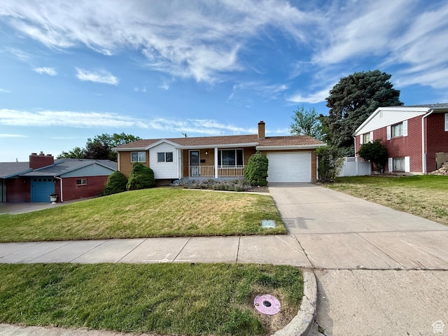 573 E 1600 S, Bountiful, UT 84010 - single story home with a garage, driveway, a porch, a chimney, and brick siding