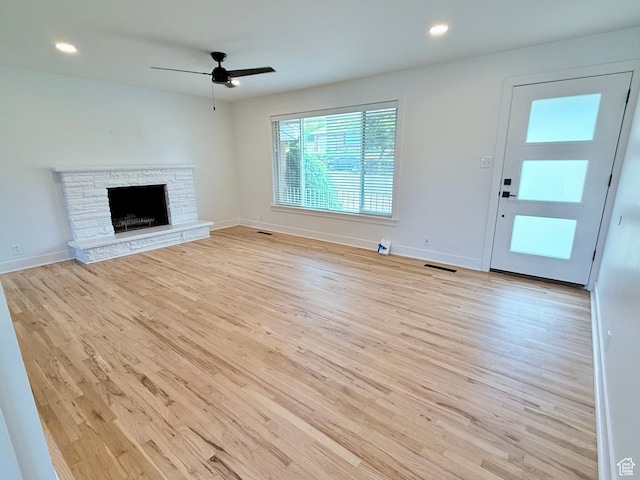 573 E 1600 S, Bountiful, UT 84010 - unfurnished living room with wood finished floors, a ceiling fan, a stone fireplace, baseboards, and recessed lighting