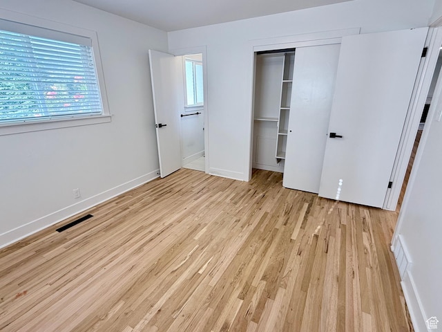 573 E 1600 S, Bountiful, UT 84010 - unfurnished bedroom with light wood-type flooring, a closet, and baseboards