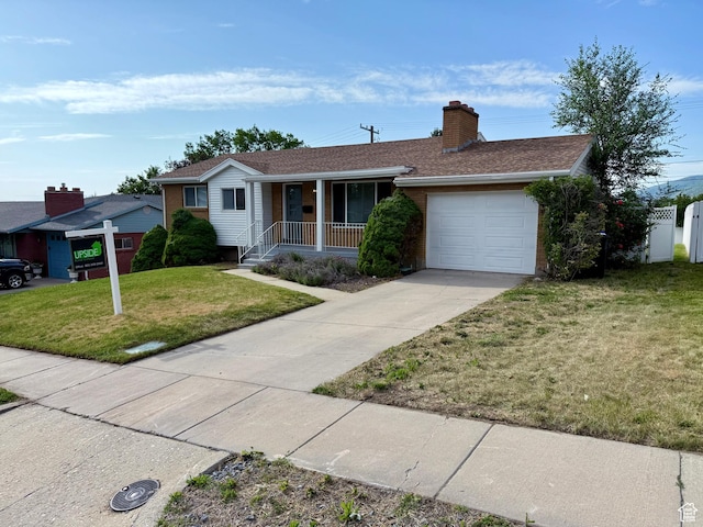 573 E 1600 S, Bountiful, UT 84010 - ranch-style home featuring covered porch, an attached garage, driveway, a front yard, and a chimney