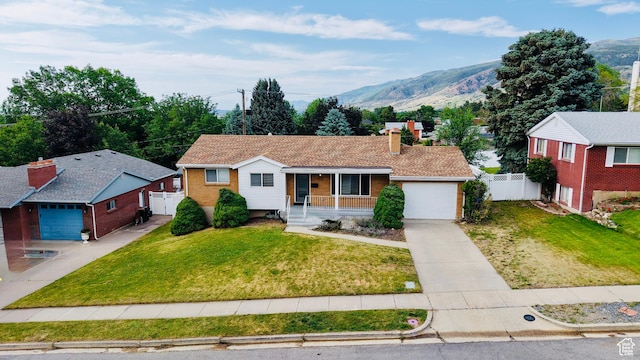 573 E 1600 S, Bountiful, UT 84010 - ranch-style house featuring covered porch, driveway, an attached garage, a chimney, and a mountain view