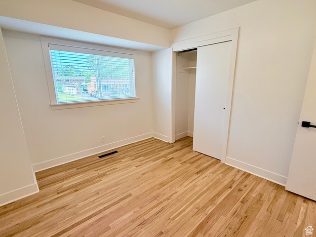 573 E 1600 S, Bountiful, UT 84010 - unfurnished bedroom with light wood-type flooring, a closet, and baseboards