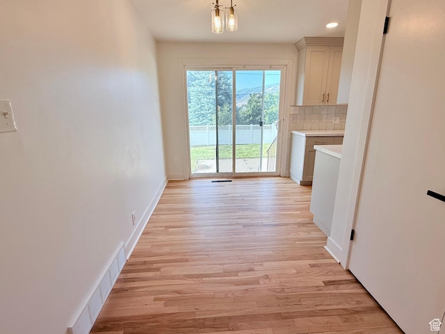 573 E 1600 S, Bountiful, UT 84010 - unfurnished dining area with light wood-style flooring, baseboards, and recessed lighting