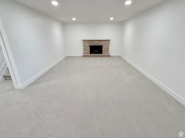 573 E 1600 S, Bountiful, UT 84010 - unfurnished living room featuring recessed lighting, light colored carpet, baseboards, a stone fireplace, and stairs