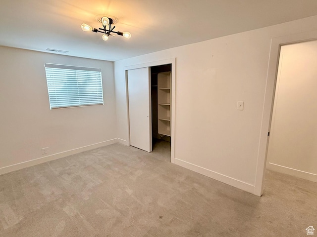 573 E 1600 S, Bountiful, UT 84010 - unfurnished bedroom with light carpet, baseboards, and a closet