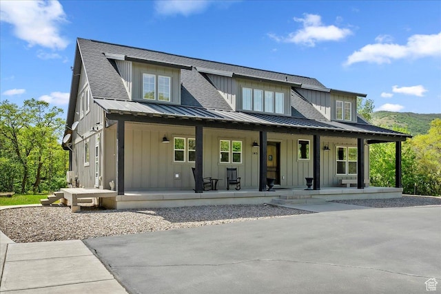 145 N 10450 E, Huntsville, UT 84317 - view of front of house with board and batten siding, a porch, metal roof, and a standing seam roof