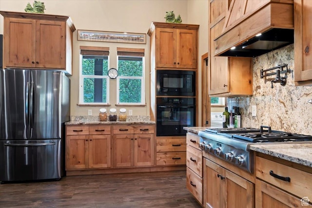 145 N 10450 E, Huntsville, UT 84317 - kitchen with black appliances, custom exhaust hood, decorative backsplash, light stone counters, and dark wood-style floors