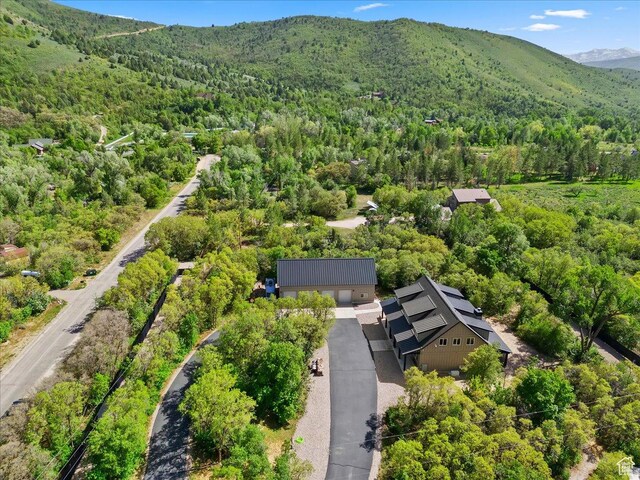 145 N 10450 E, Huntsville, UT 84317 - aerial view of property and surrounding area with a forest and a mountain backdrop