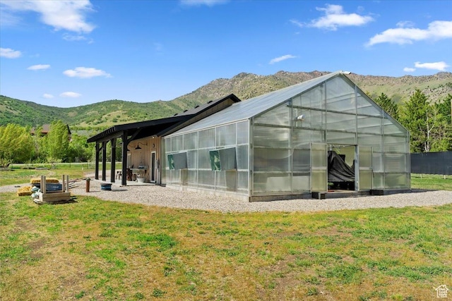 145 N 10450 E, Huntsville, UT 84317 - rear view of house with an exterior structure, a mountain view, and an outbuilding