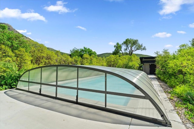 145 N 10450 E, Huntsville, UT 84317 - view of swimming pool with a wooded view