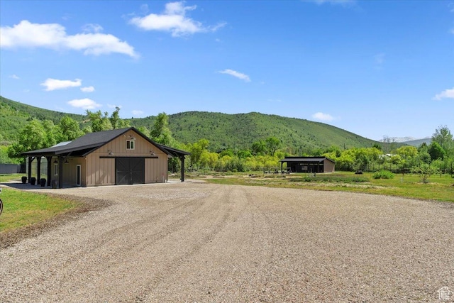 145 N 10450 E, Huntsville, UT 84317 - view of dirt / gravel driveway featuring a mountain view and a pole building